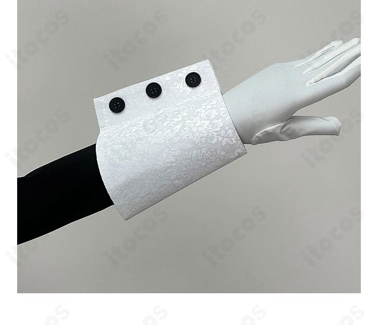 袖口の装飾と手首飾りの細部。レースの重なりと留め具の仕上げが見えるアップ。