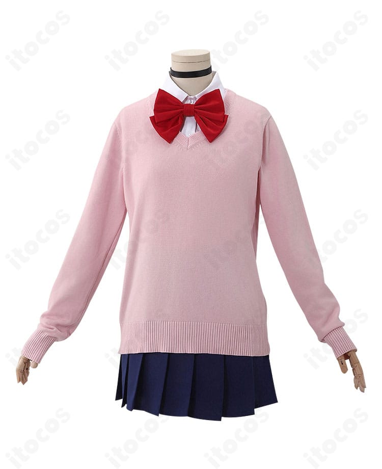 ダンダダン 綾瀬桃 衣装ディテール。襟元の蝶結び、セーターの編み目表情、ボタン周りの仕立てが確認できる接写。