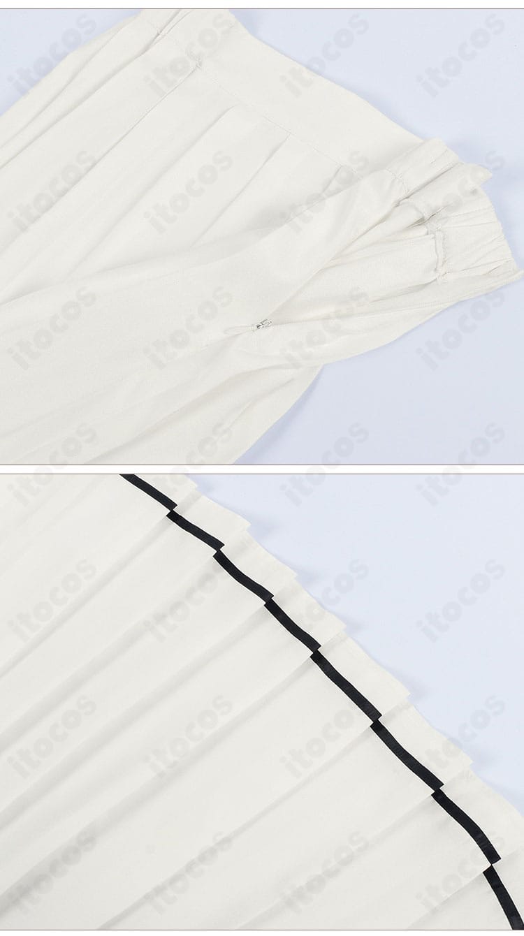 スカートのプリーツとヘム処理を強調した装飾ディテール。