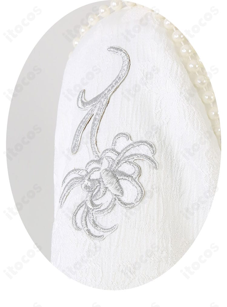 Eden ヴェリテ衣装の袖刺繍ディテール。高級感のある刺繍とパイピングを強調