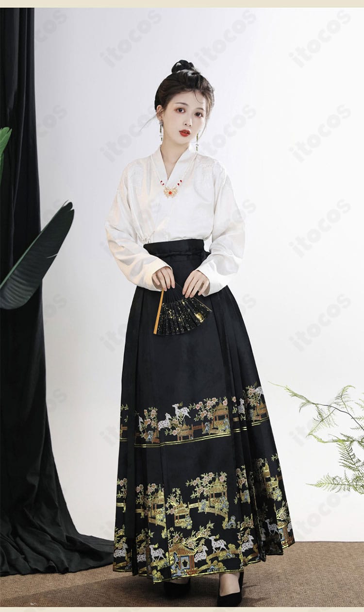 トップスとスカートの正面ディテール。上質生地の質感とパネル構成が分かる近接ショット。