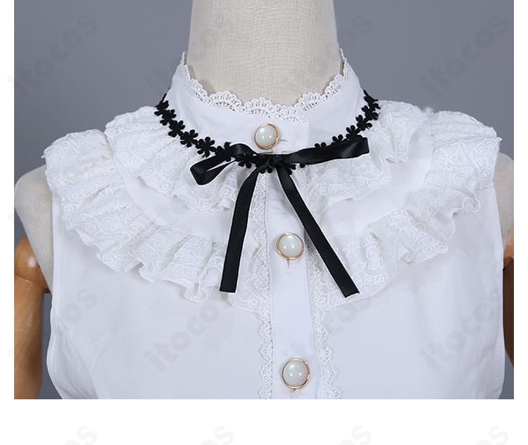 襟元のリボンディテール。蝶結びのボリューム感と形状が伝わる接写。