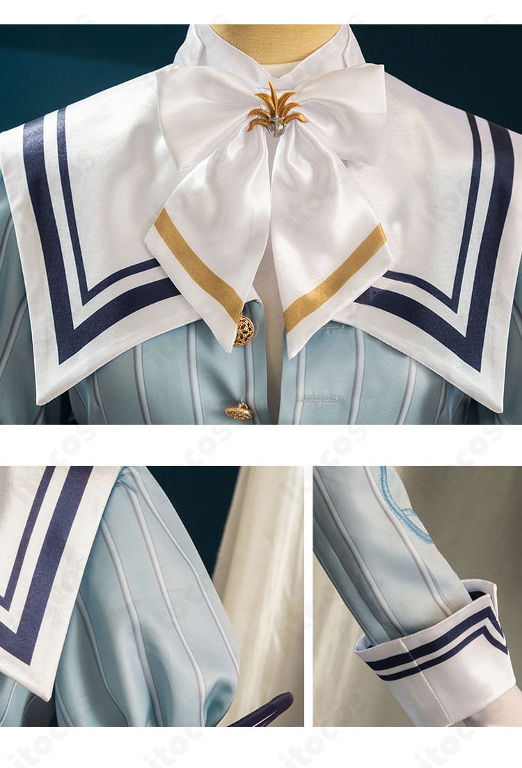 襟元と袖口の装飾ディテール。縁取りと飾りボタンでクラシックな印象を表現。