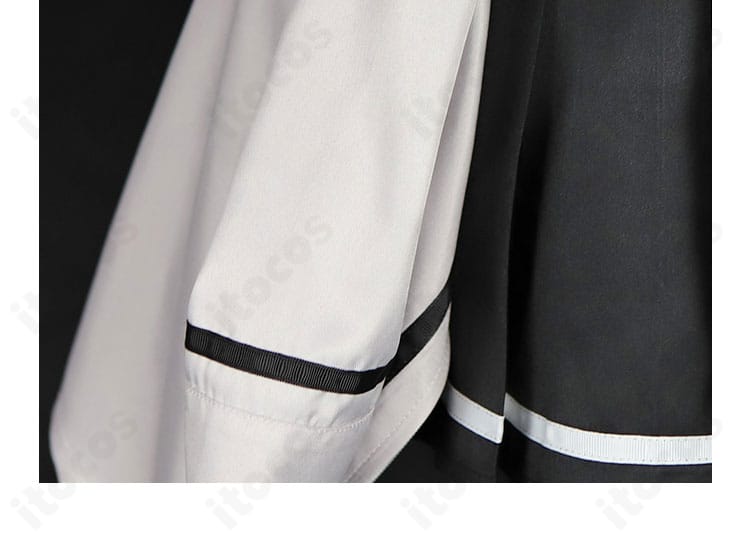 コートの装飾ディテール。肩章風の意匠と袖口の装飾を拡大し、重厚感と上品さを表現。