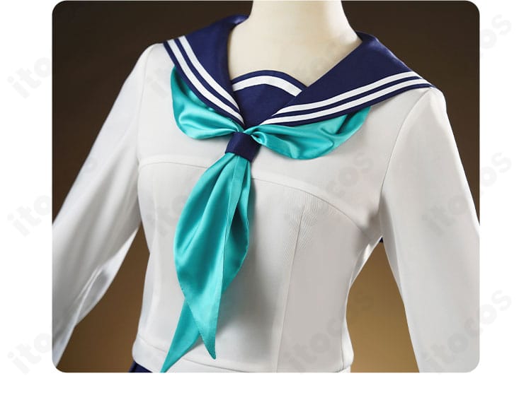 ネクタイ風スカーフの結び部分アップ。色味のコントラストと結び形の美しさを示す。